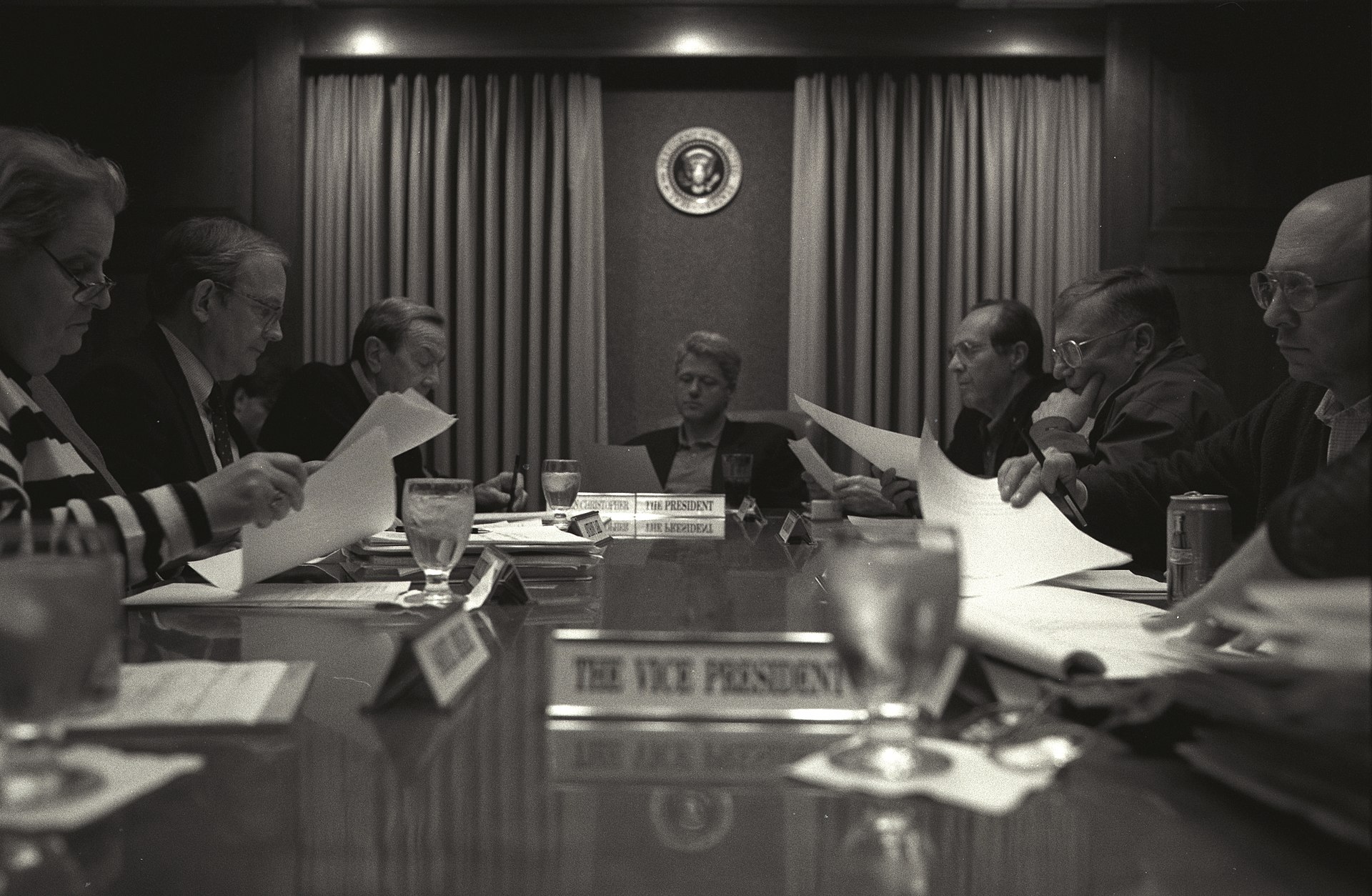 Executive review table with document-led oversight